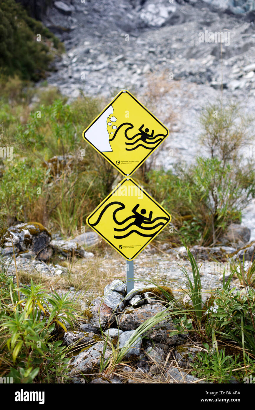 Warning signs near the terminal face of the Fox Glacier in Westland Tai ...