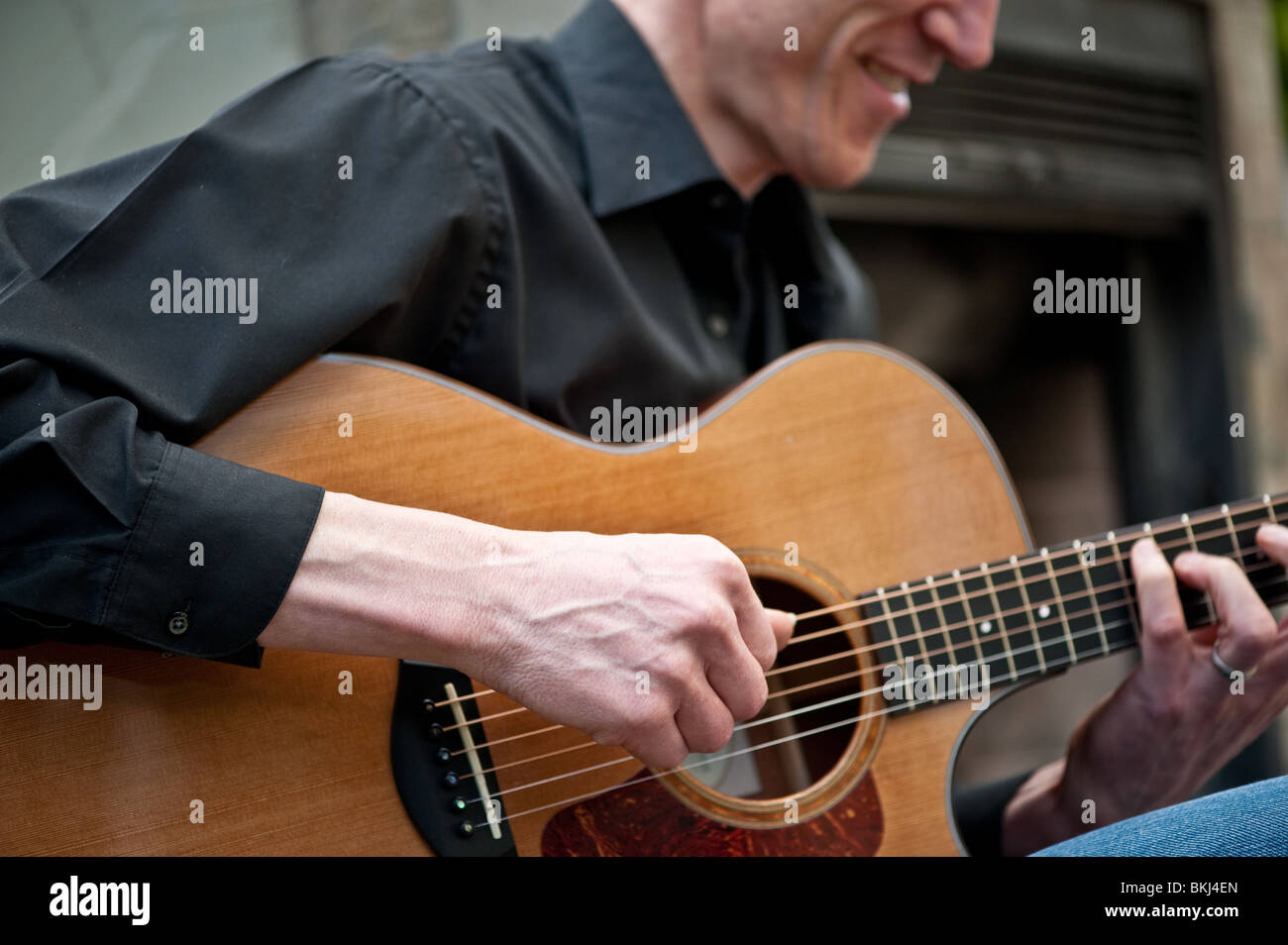 A close up view of a musician playing guitar Stock Photo