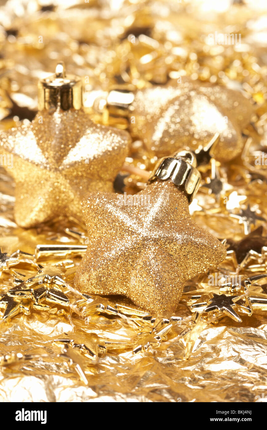 Christmas gold stars on the gold background Stock Photo - Alamy