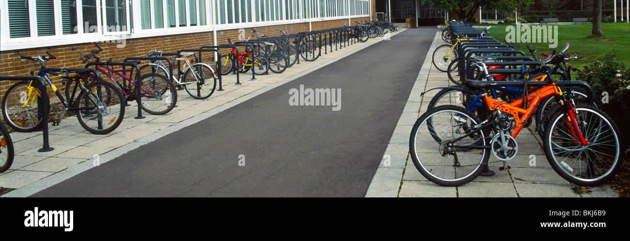 Bicycles Parked In Racks Outside High School Stock Photo