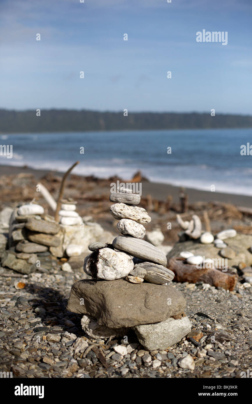 Stone cairns left on the beach near Greymouth on the West Coast of New Zeland's South Island Stock Photo