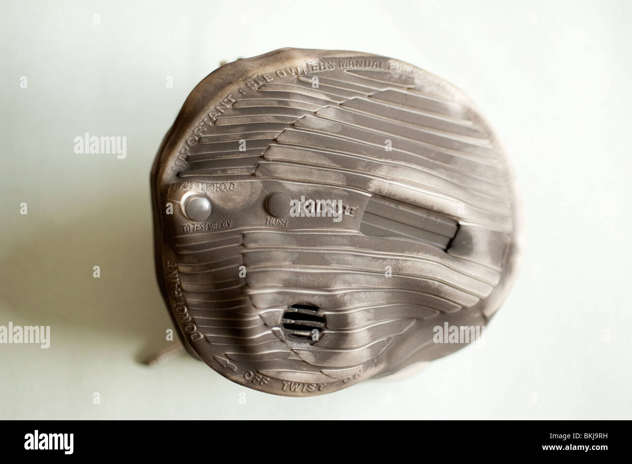 Melted burnt Smoke Alarm that saved the lives of 5 people in a real house fire Stock Photo