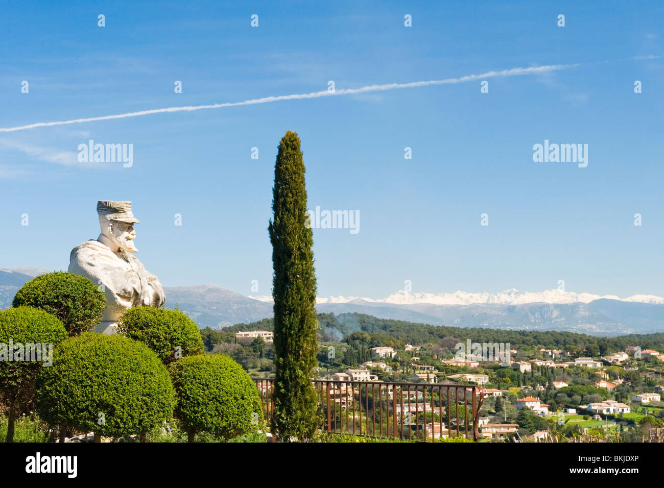 Mougins , Province , statue of Commandant Lamy , local hero , overlooks the countryside with the snow capped Alpes Maritimes Stock Photo