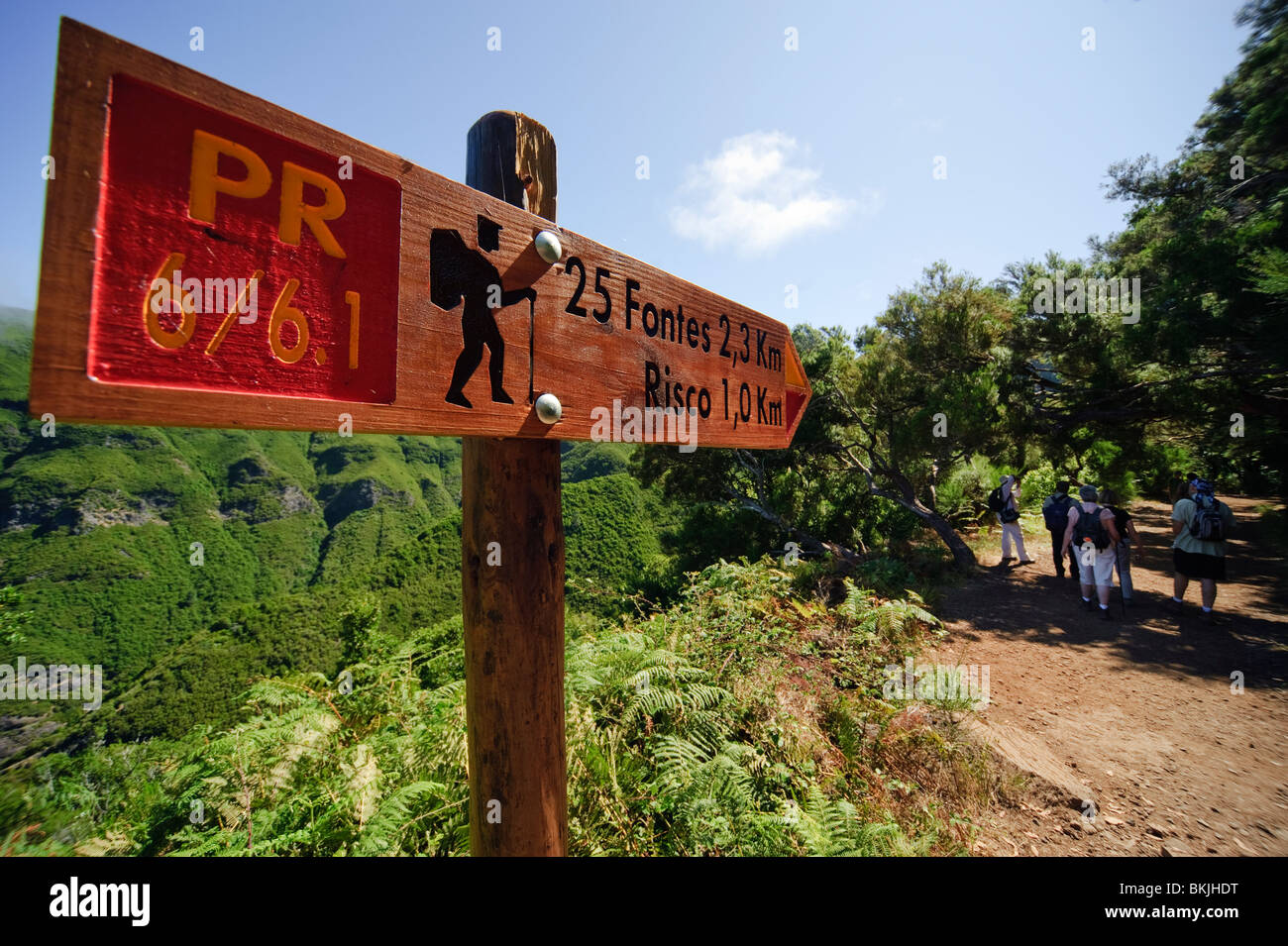 Signpost and walking group on track beside the Levada do Risco near Rabacal, Madeira Stock Photo