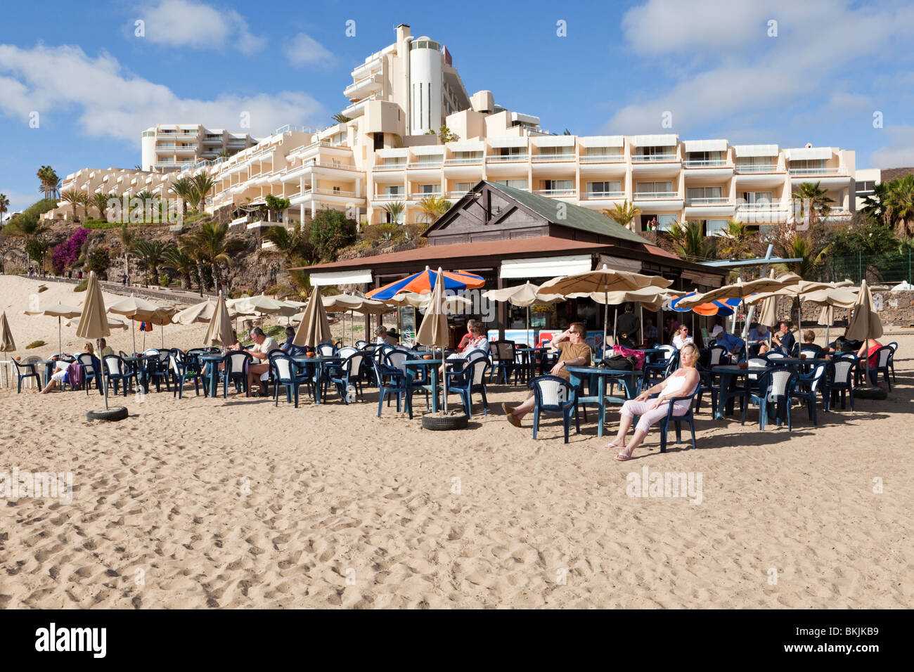 A cafe on the beach in front of the Riu Palace Hotel in the coastal resort of Jandia on the Canary Island of Fuerteventura Stock Photo