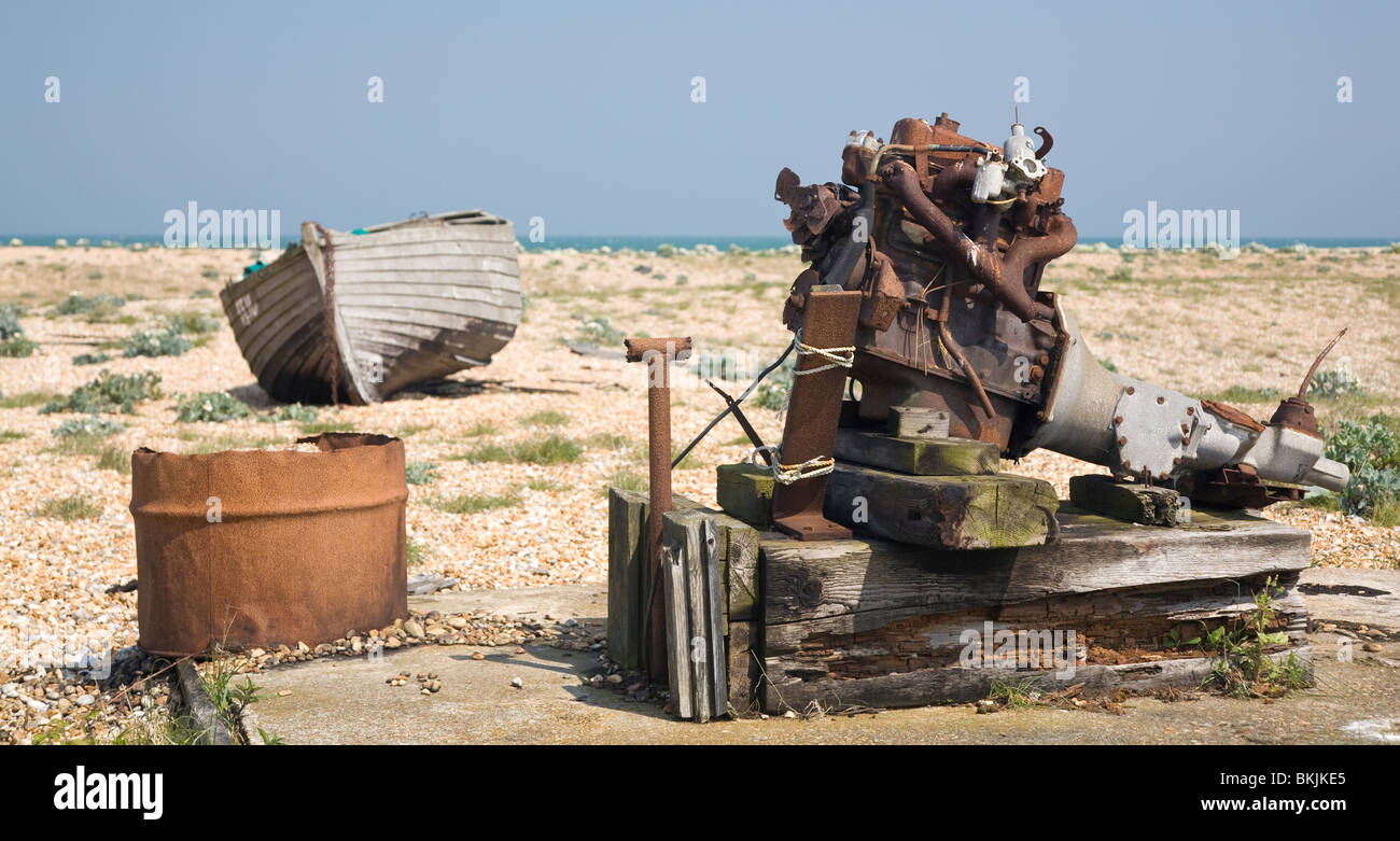 abandoned wrecked fishing boat and engines on the shingle beach in ...