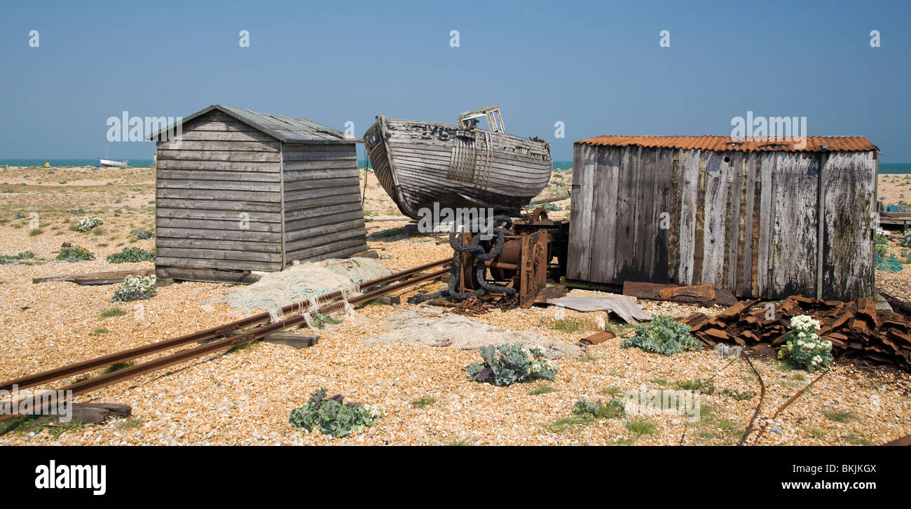 abandoned wrecked fishing boat and engines on the shingle beach in ...