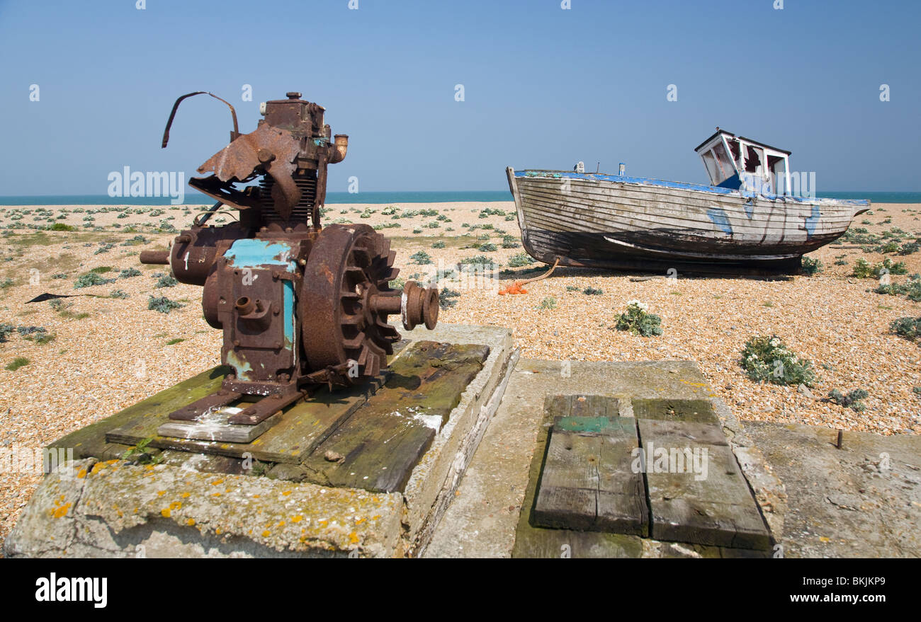 abandoned wrecked fishing boat and engines on the shingle beach in ...