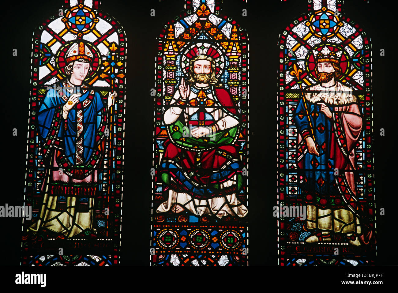 England, London, All Saints church, Stained glass window depicting Saint Augustine of Hippo, Jesus Christ and Saint Edward Stock Photo
