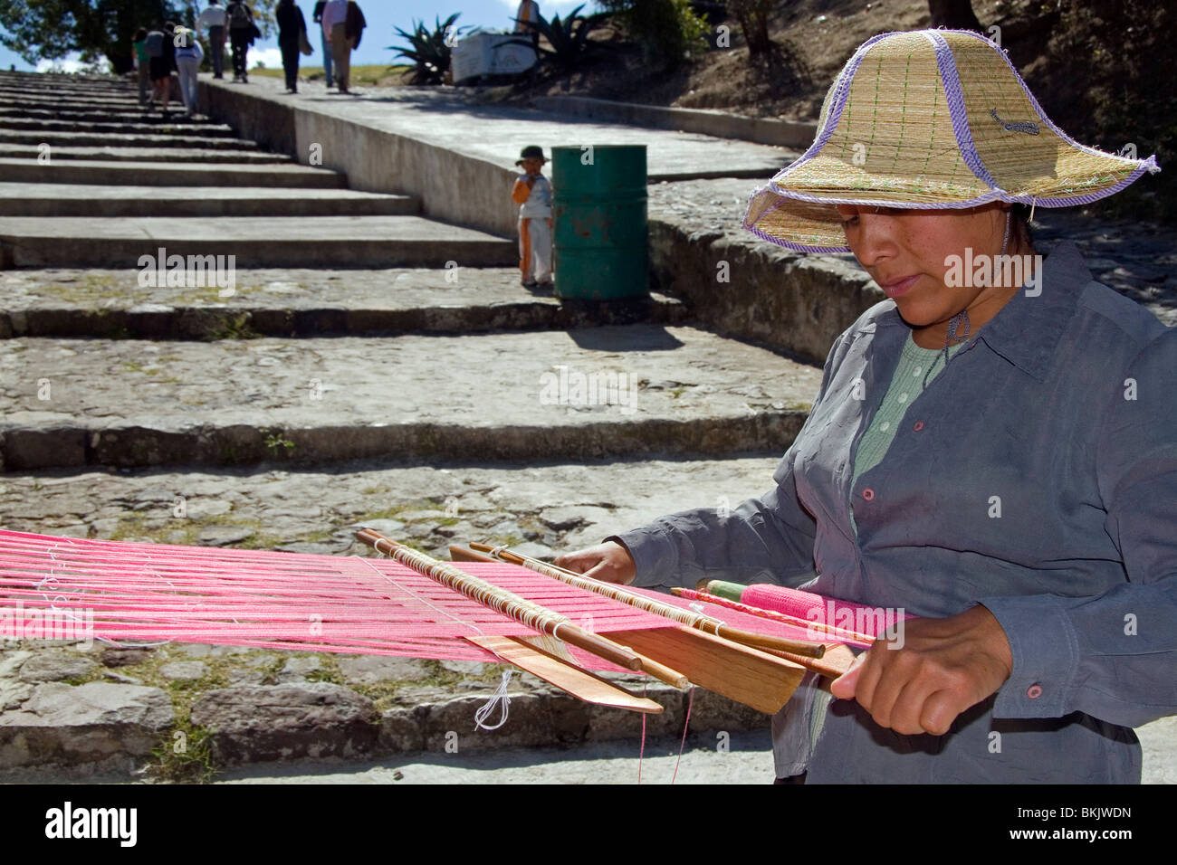 Mexican woman weaving with a loom in the town of Cholula, Puebla, Mexico. Stock Photo