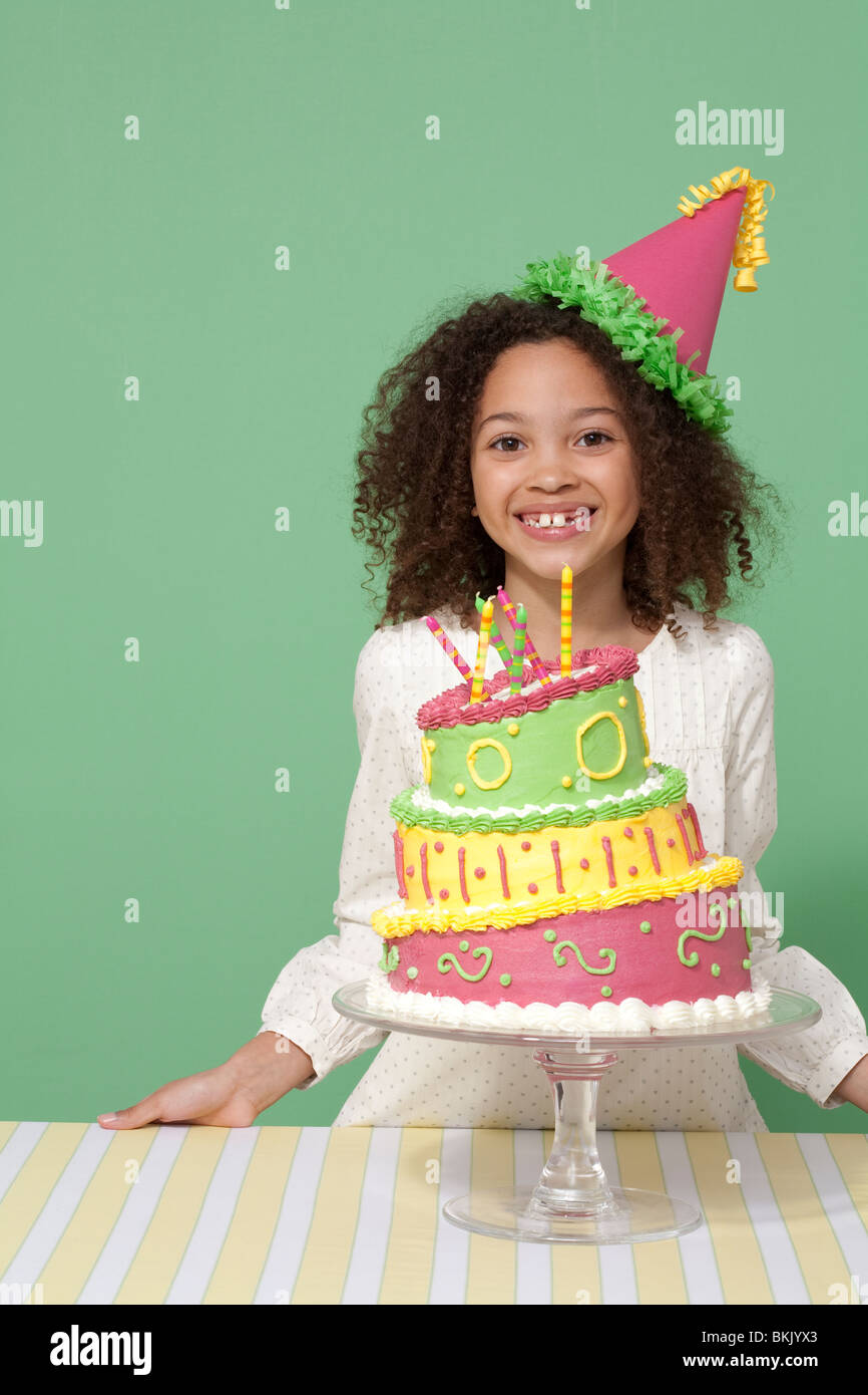 Girl with Birthday cake, blowing out candles Stock Photo Alamy