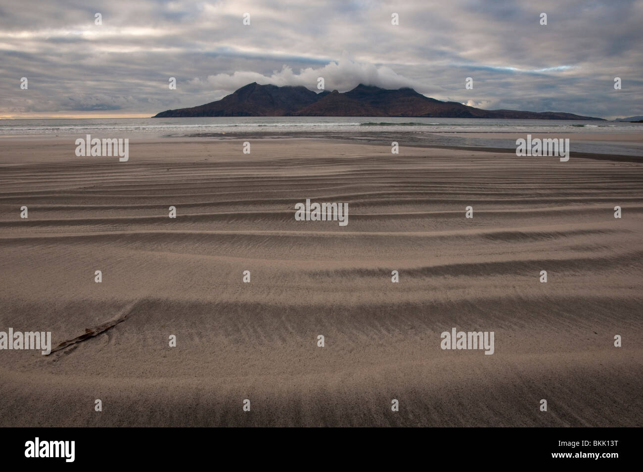 The Island of Rum as seen from the Bay of Laig volcanic beach, Cleadale, Eigg. Stock Photo