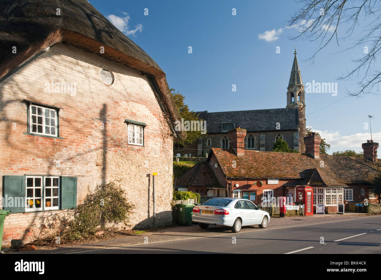 The Thames village of Clifton Hampden with a view of the Post Office and Church of St Michael and All Angels, Oxfordshire, Uk Stock Photo