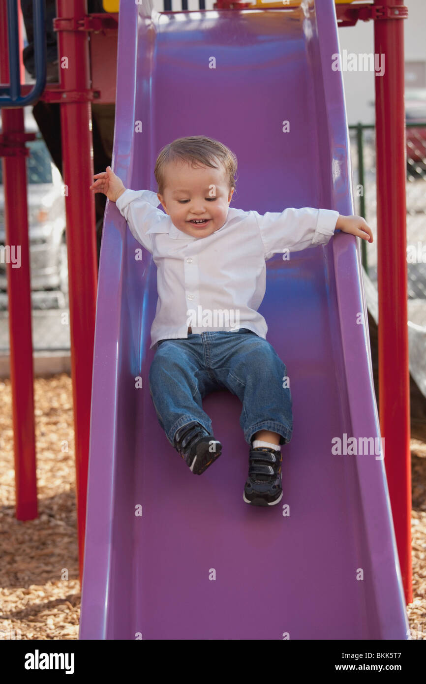 Happy boy going down slide hires stock photography and images Alamy