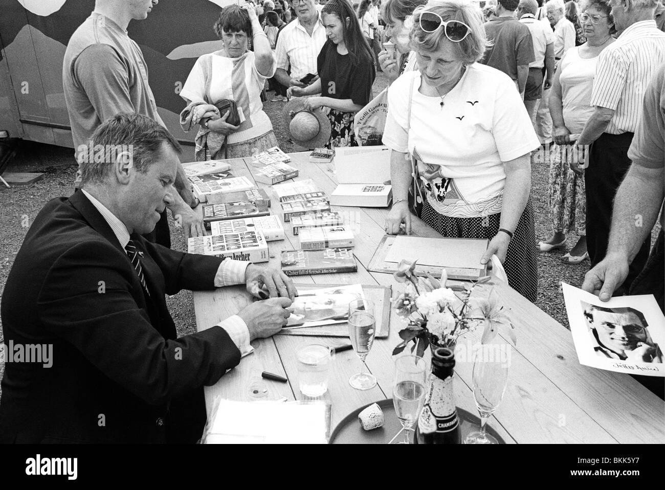 Jeffrey Archer book signing outdoors at 1992 Hay Literature Festival Hay-on-Wye Powys Wales UK Stock Photo