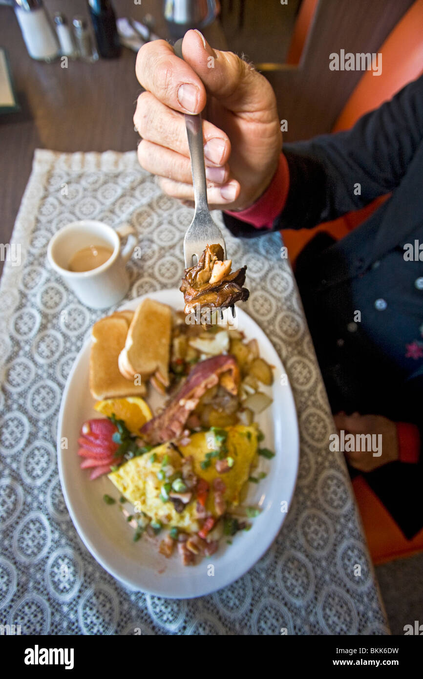 Man dressed as 1800s town marshal eats 'hangtown fry,' a hearty meal that dates  to the gold rush of the mid 1800s in California Stock Photo