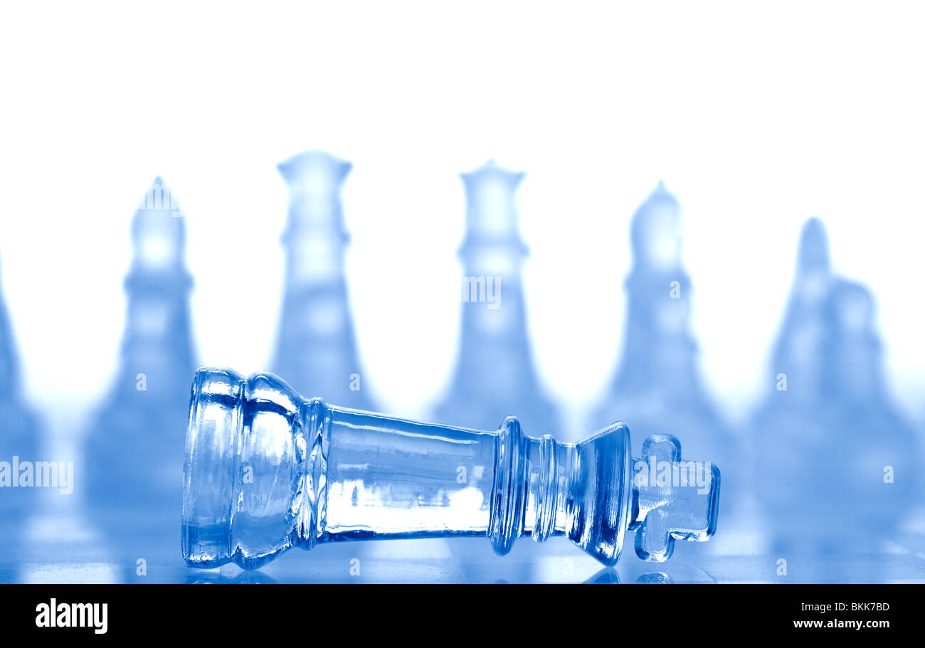 glass chess pieces with blue light Stock Photo