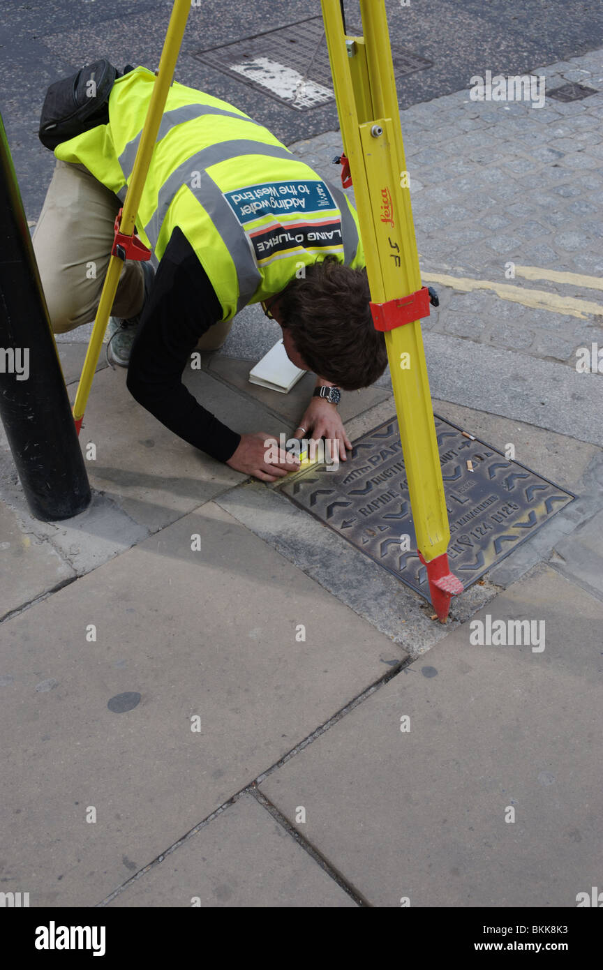 Surveyor Using An Automatic Level Measuring Device On The Surround