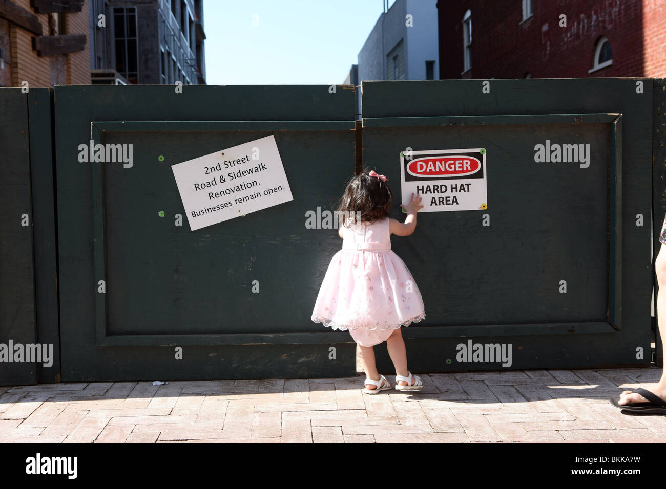 Little girl checking out signs. Stock Photo
