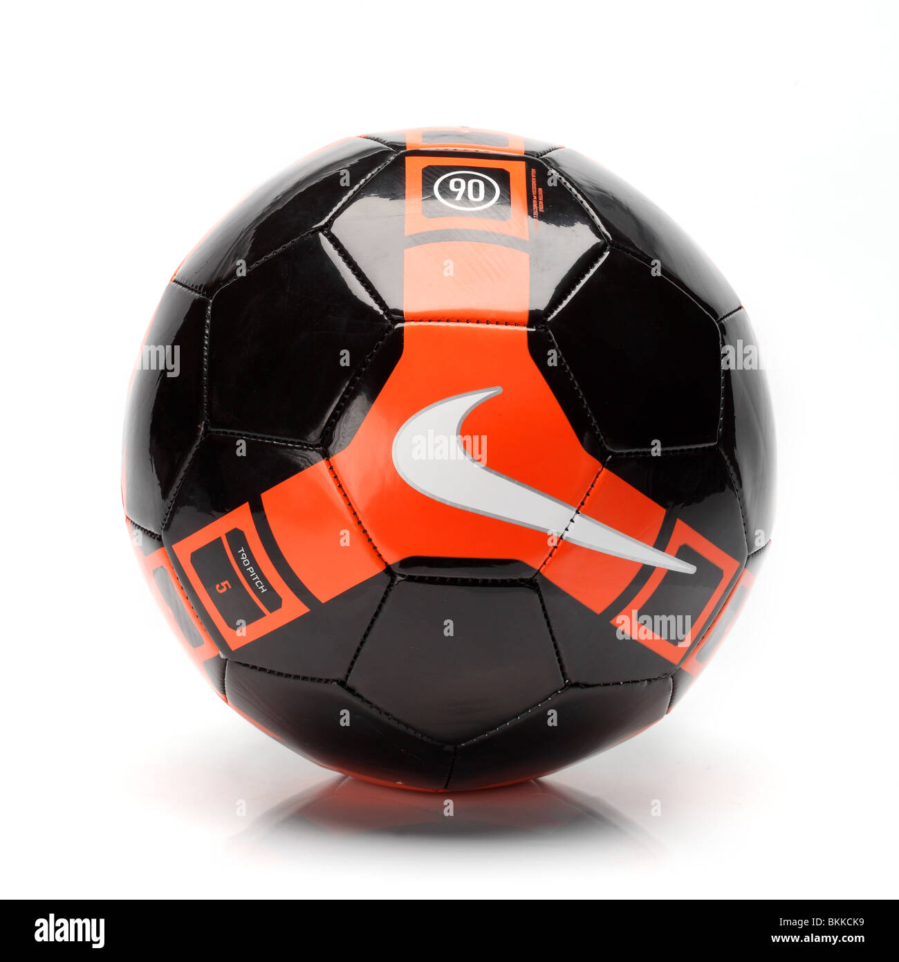 Nike team foot ball soccer football black orange T 90 Stock Photo