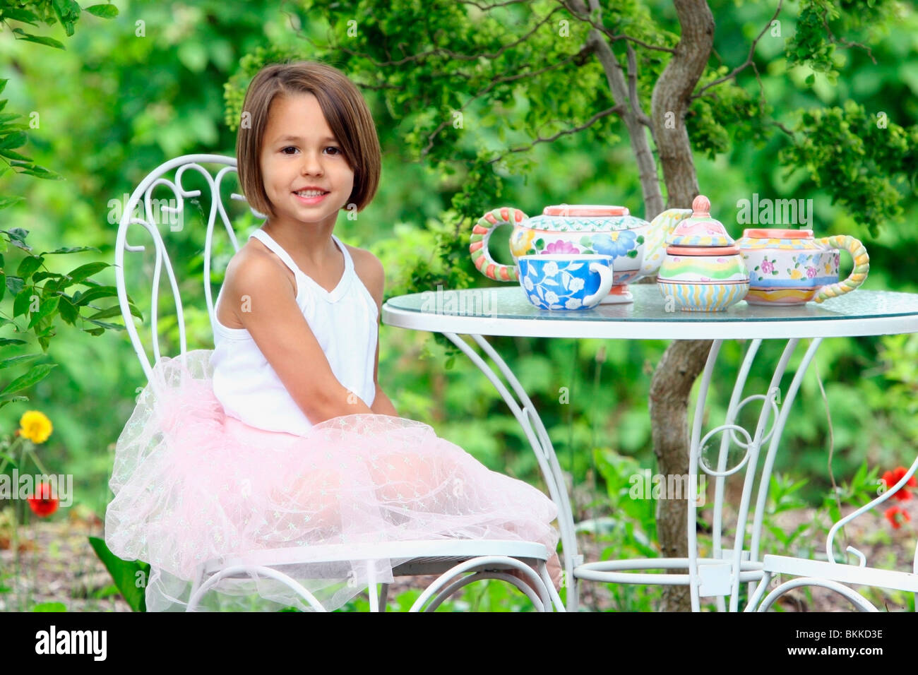 A Young Girl Having A Tea Party Stock Photo - Alamy