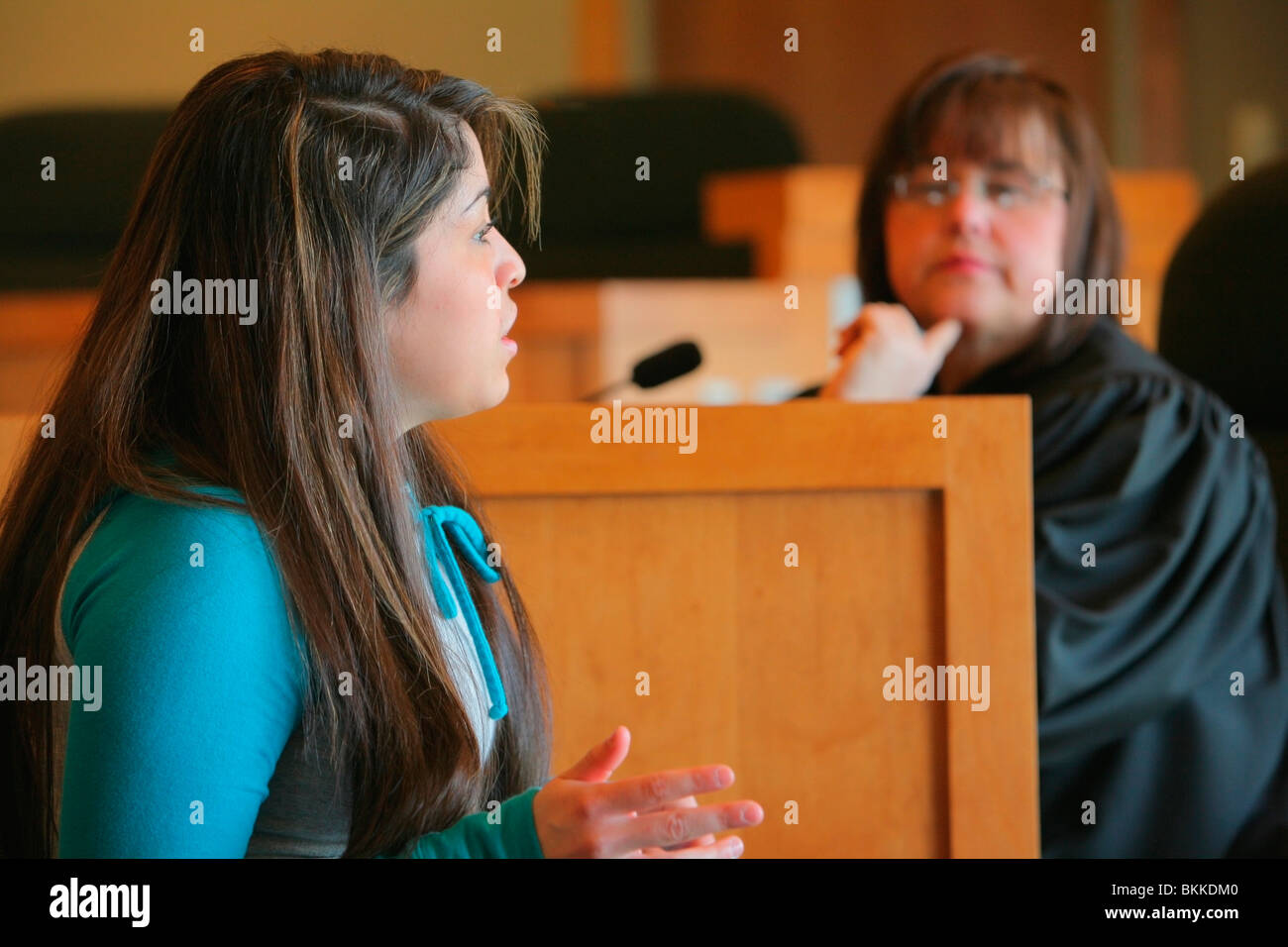 A Girl Talking To A Judge Stock Photo