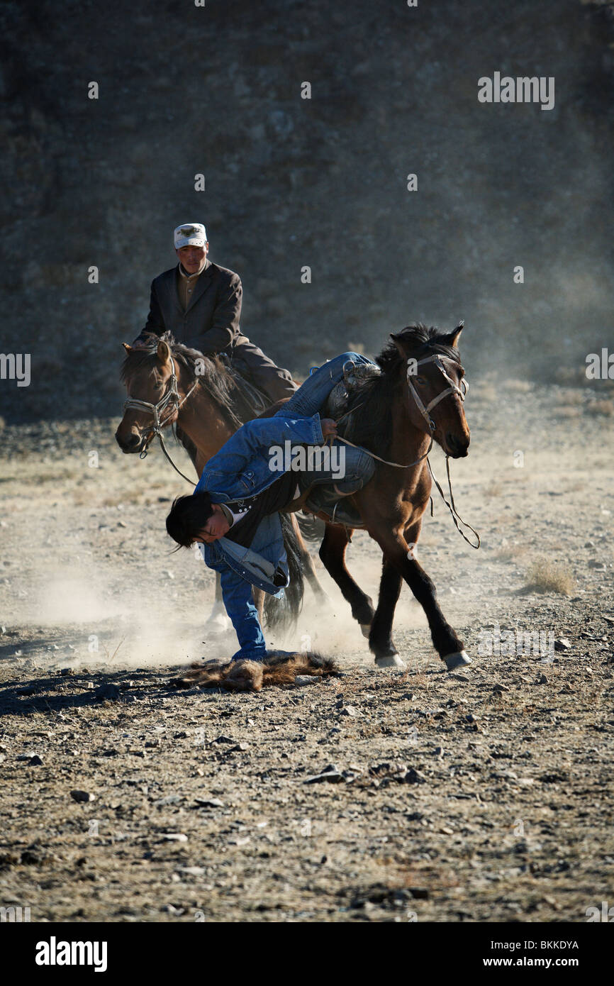 Horse wrestling match (kokpar) at the yearly Golden Eagle festival in Bayan Olgii, Western Mongolia. Stock Photo