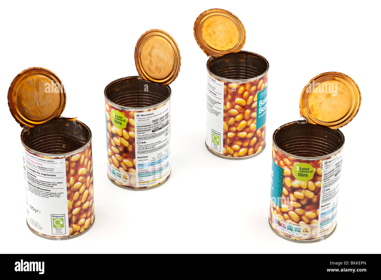 Four empty baked bean cans Stock Photo