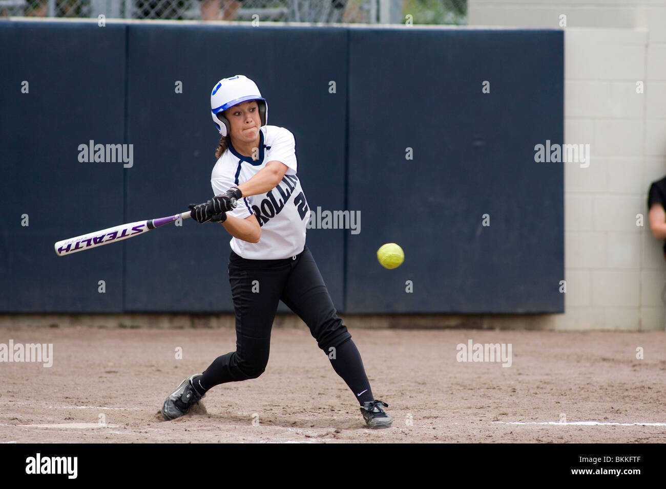 Softball player batting ball Stock Photo Alamy