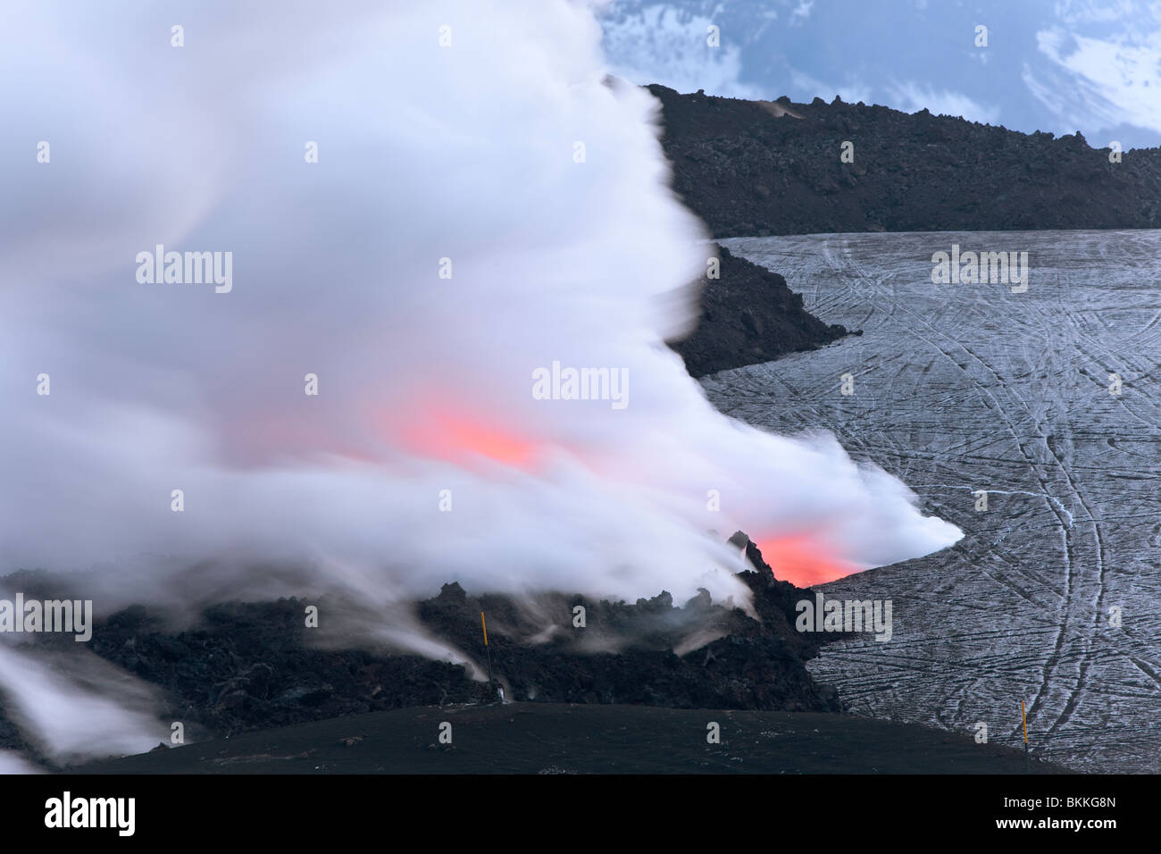 Lava flows from the Iceland 2010 volcanic eruption of the Eyjafjalla volcano melting down snow and ice from the Eyjafjallajökull Stock Photo