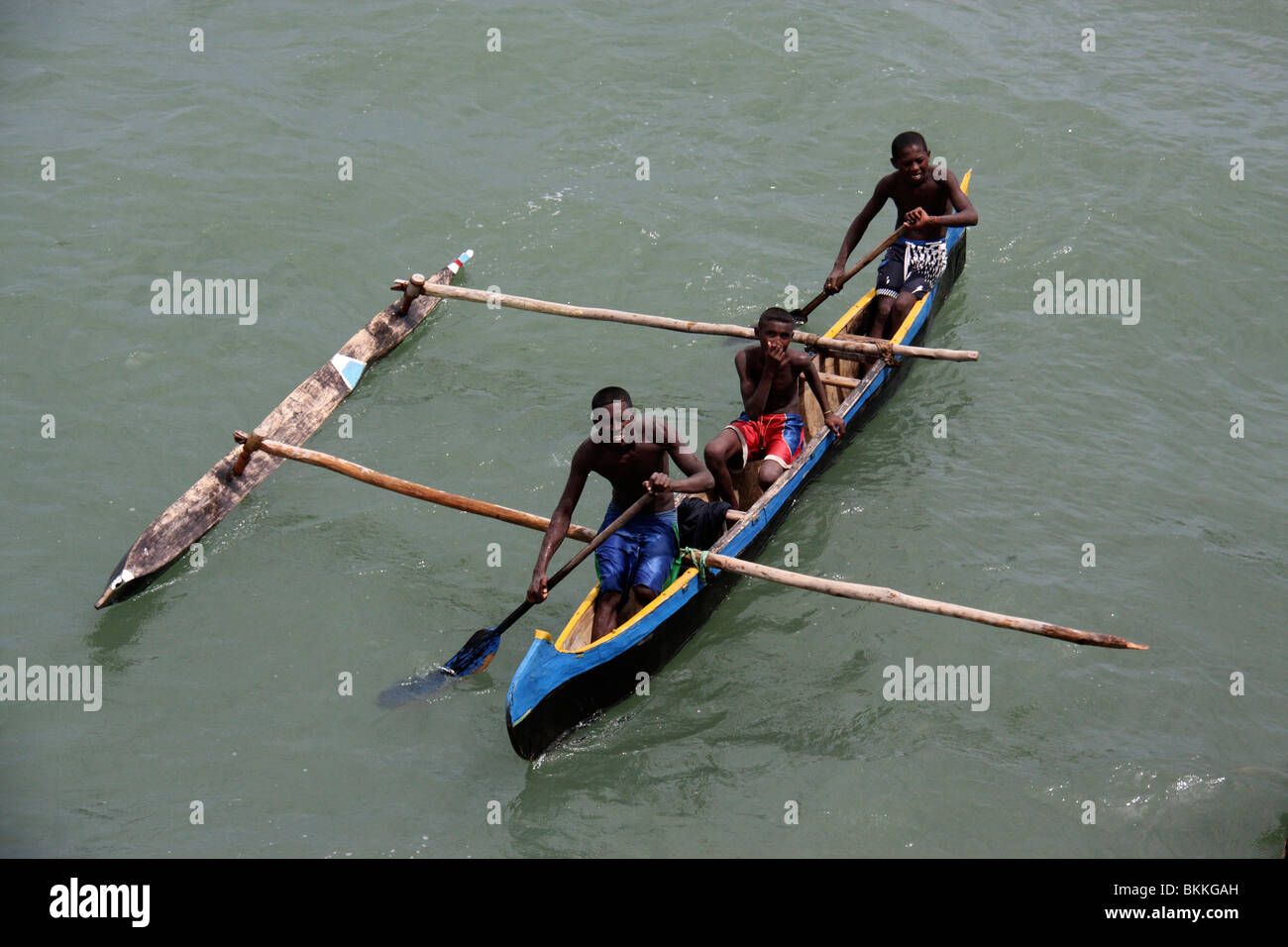 starving african street kids asking for food in wooden boats,Africa Stock Photo