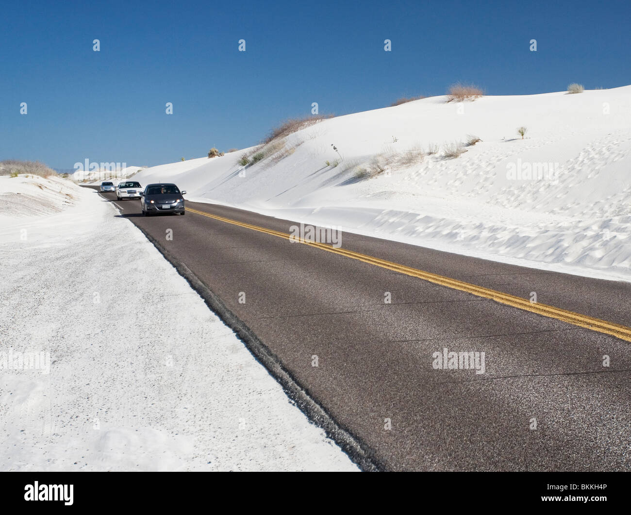 Cars drive on the loop road through White Sands National Monument, New