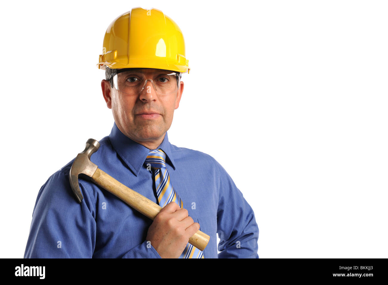 Hispanic construction manager holding hammer isolated over white background Stock Photo