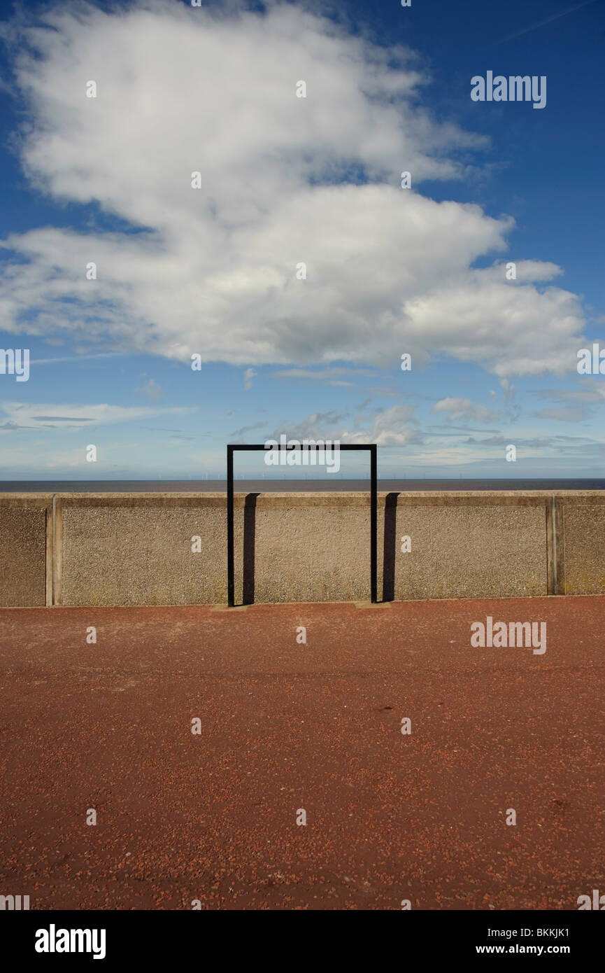 enigmatic black structure on the promenade sea wall at at Rhyl, north wales UK Stock Photo