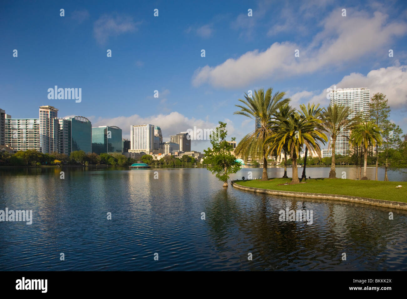 Modern architecture skyline of Orlando Florida reflecting in Lake Eola Stock Photo