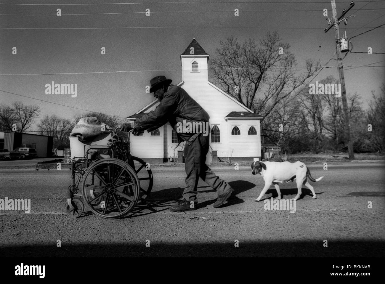 A homeless man collecting tincans along the highway in Louisiana Stock