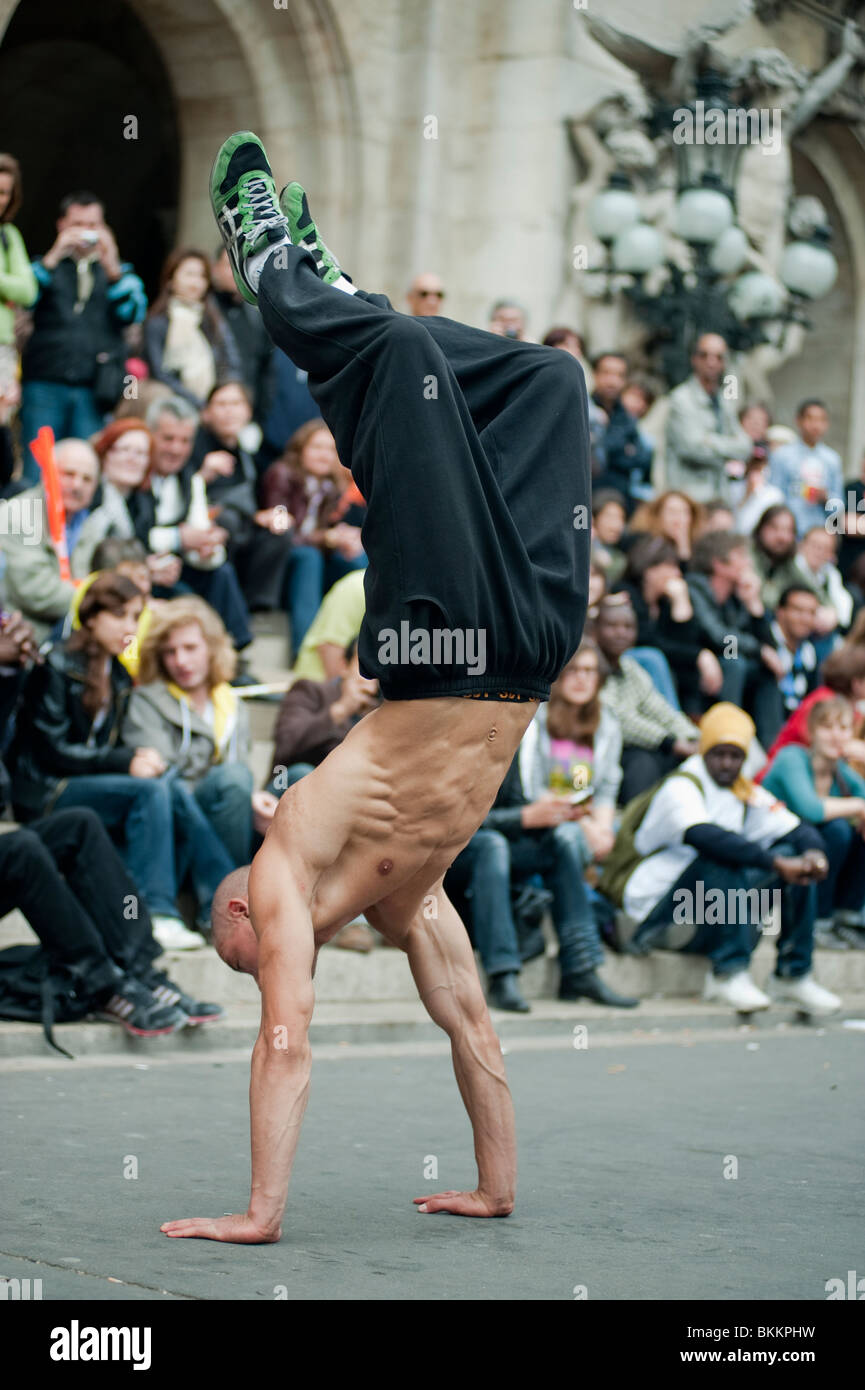 Crowd Watching Break Dancer Street performers, Paris France, Man on Hands Stock Photo