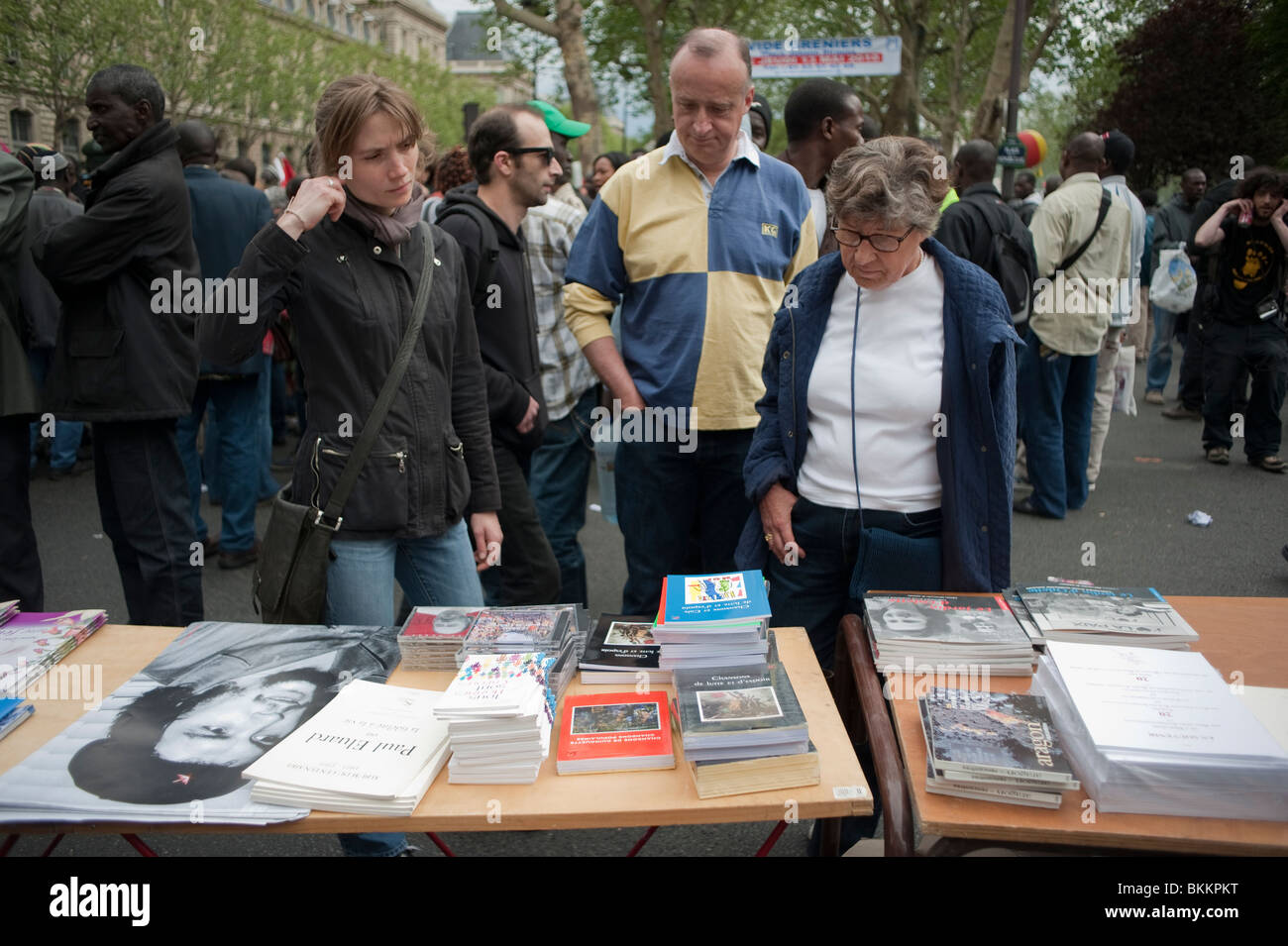 Group People Shopping Books at Street Stall, May 1, May Day Demonstration, Paris, France Stock Photo
