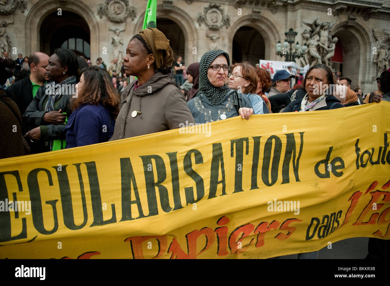 Crowd Arab Women Demonstrating in May 1, May Day Demonstration, Paris, France, 'Sans Papiers' Illegal Migrants Holding Protest Banner on Street, immigrants Europe, integrated, Women in Veil, immigration protests Stock Photo
