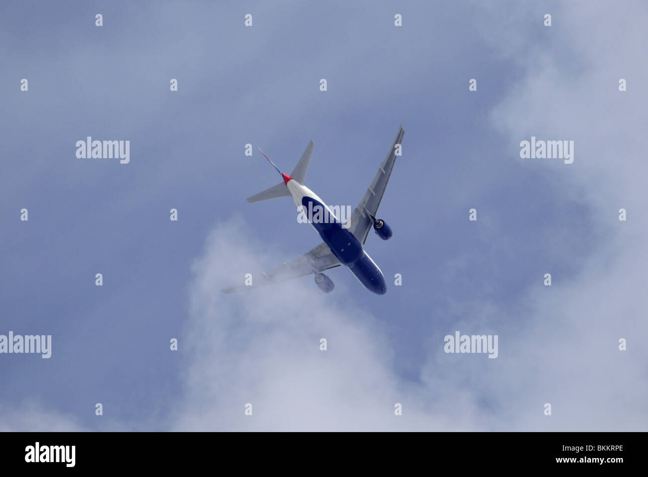 British Airways jet banking through cloud Stock Photo
