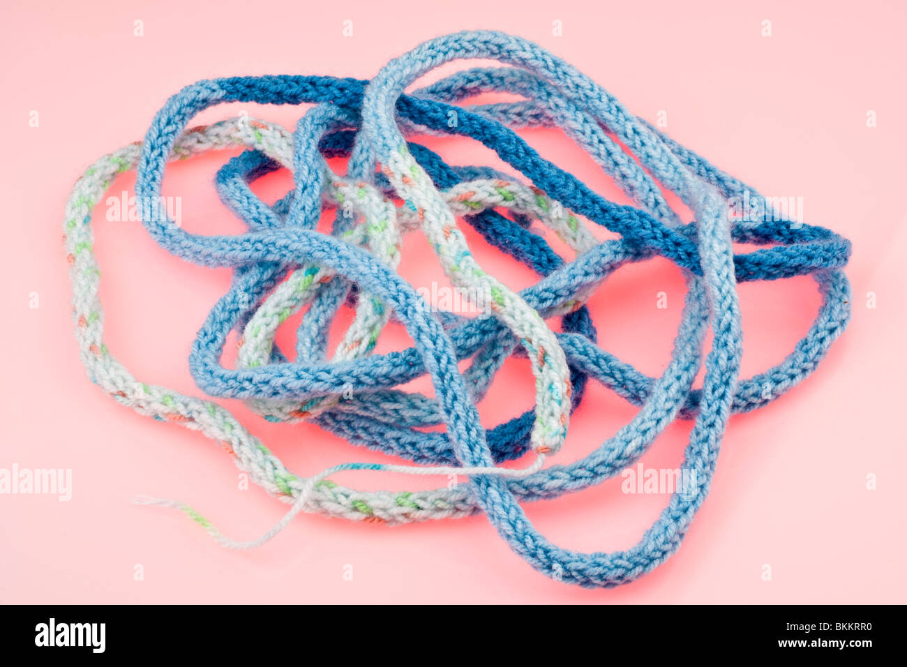 Long piece of braided blue wool French knitting Stock Photo