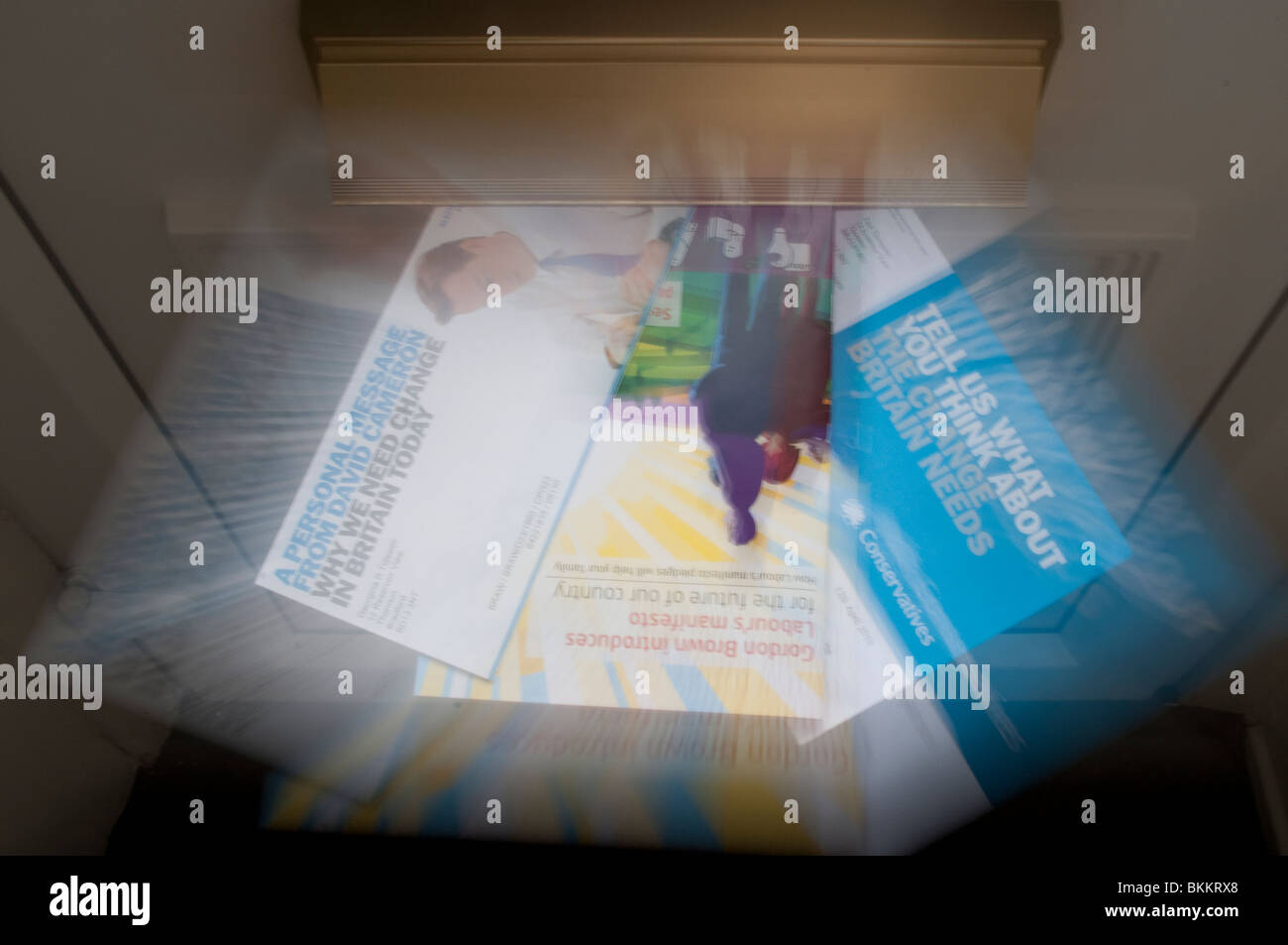 General Election 2010, Labour and Conservative Party leaflets in a letterbox. Stock Photo