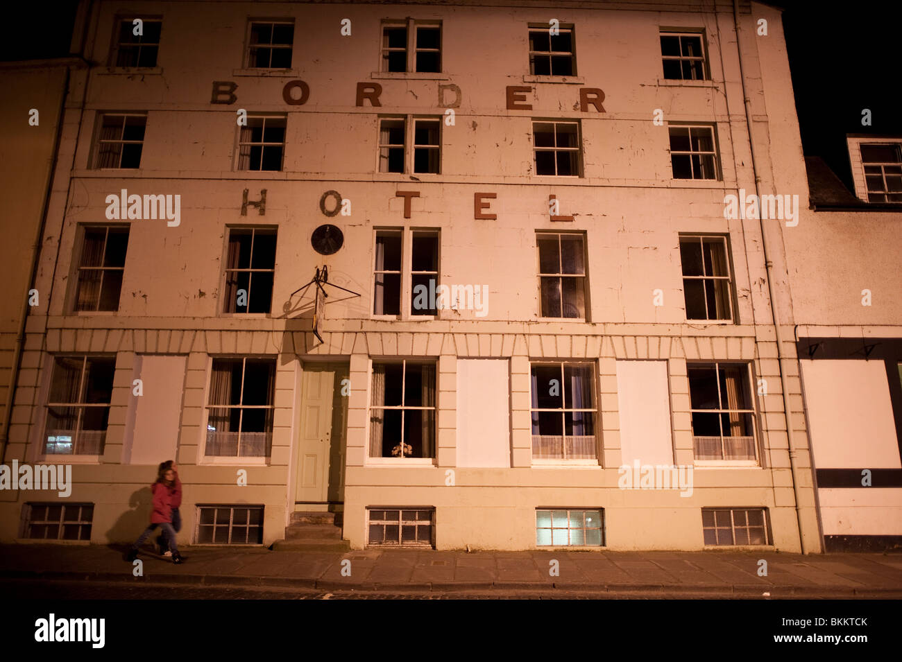 The old Border Hotel in Kelso town, Scotland, after dark illuminated by street lamps Stock Photo