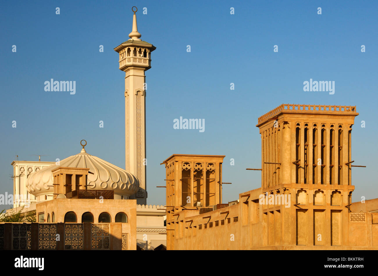 Modern mosque and traditional Arab wind towers in the Bastakiya Quarter