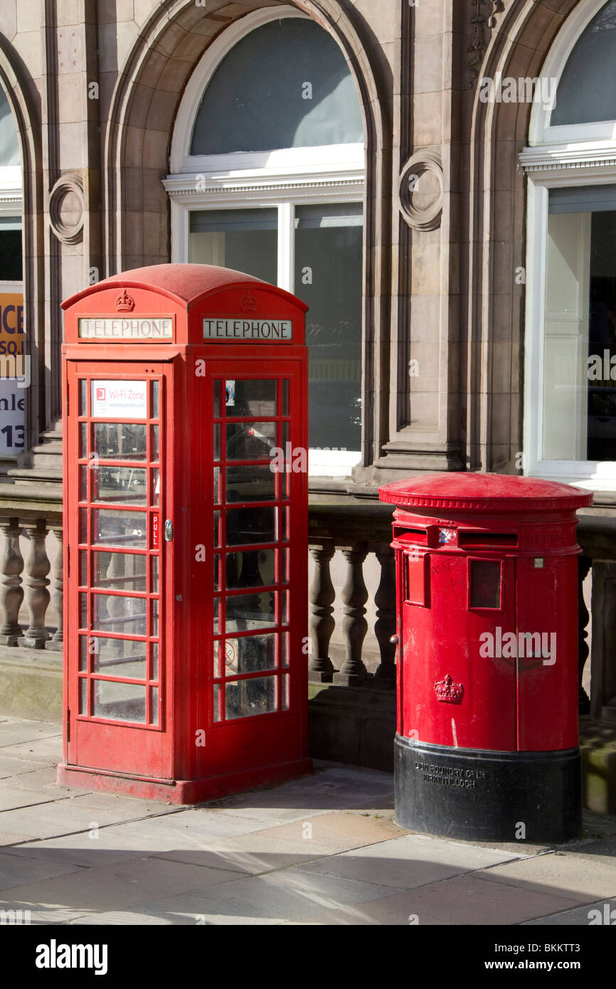 Red livery for telephone and post boxes in St Andrew's Square Edinburgh UK Stock Photo