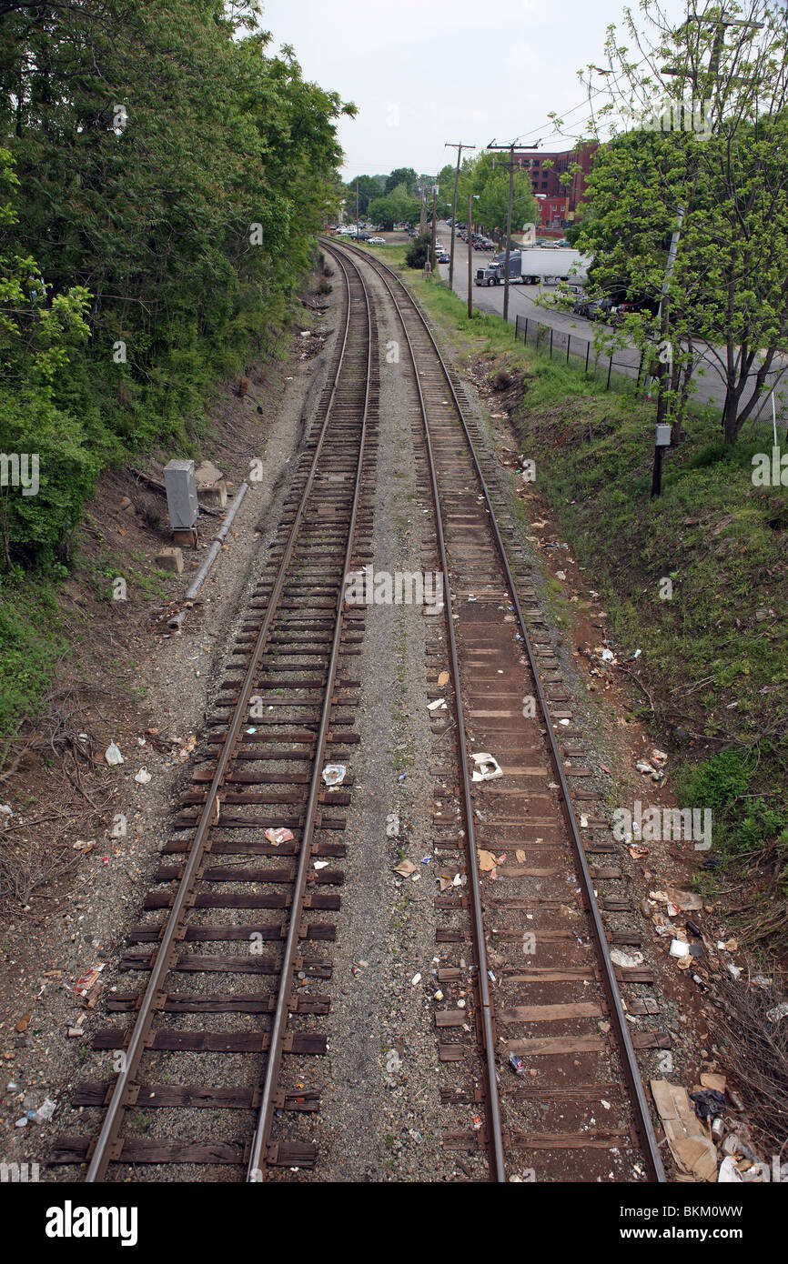 Train tracks run through Charlottesville, Virginia on a somber spring morning. Stock Photo