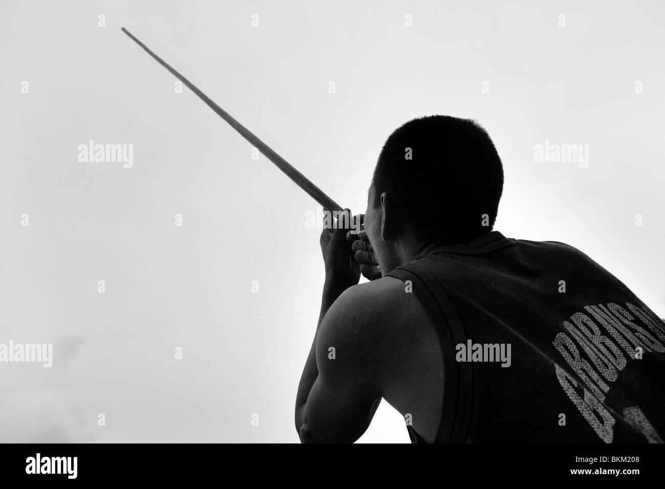 A Nukak hunter with his blowgun in a refugee camp close to San Jose del Guaviare, Colombia. Stock Photo