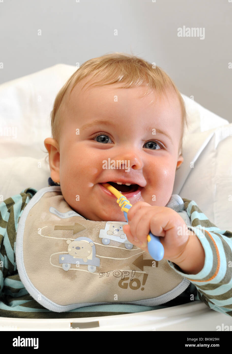 Baby boy cleaning milk teeth England Uk Stock Photo Alamy