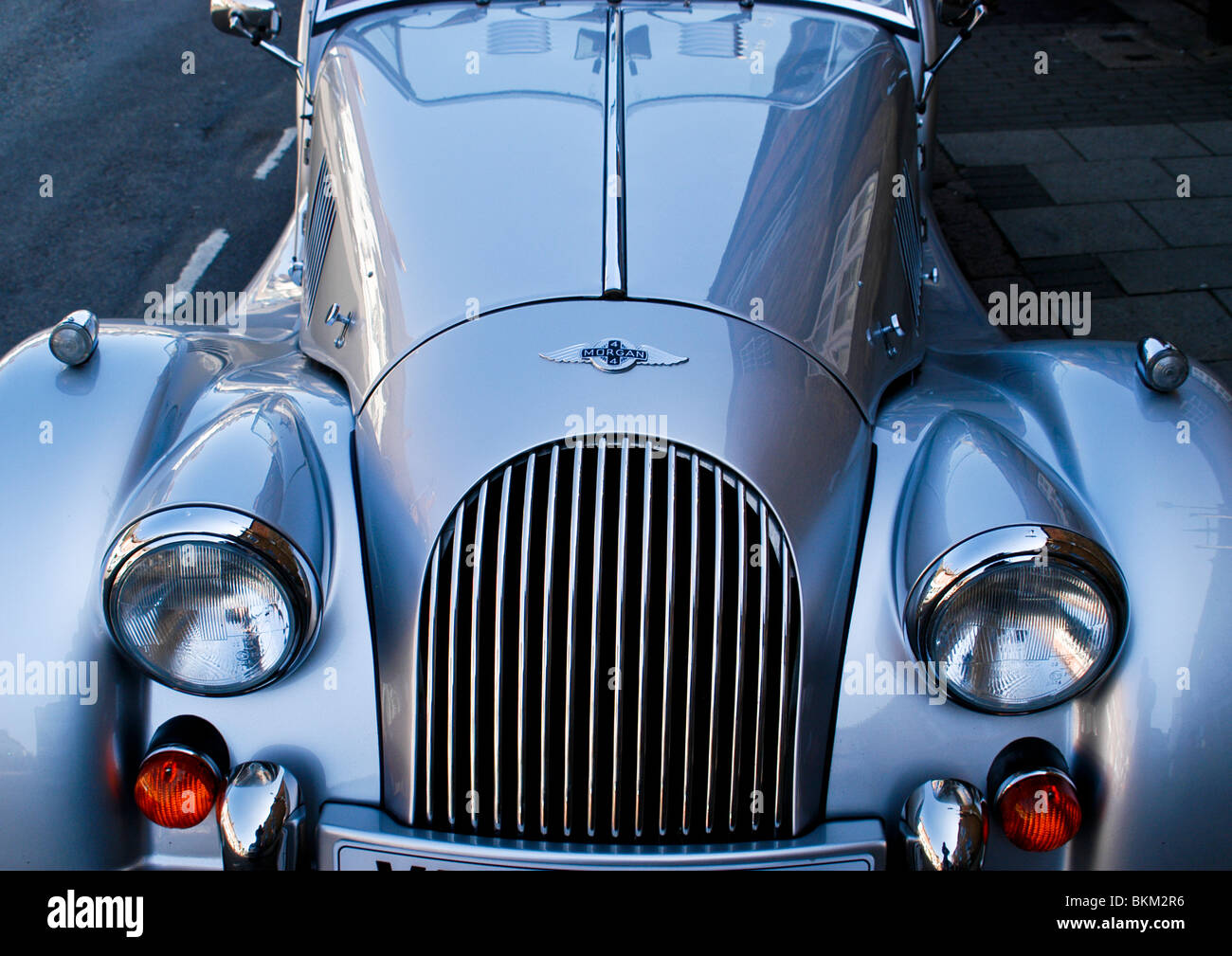 Martin silver metallic  vintage sports car view from front displaying exquisite lights, classical shape, and thrilling style. Stock Photo