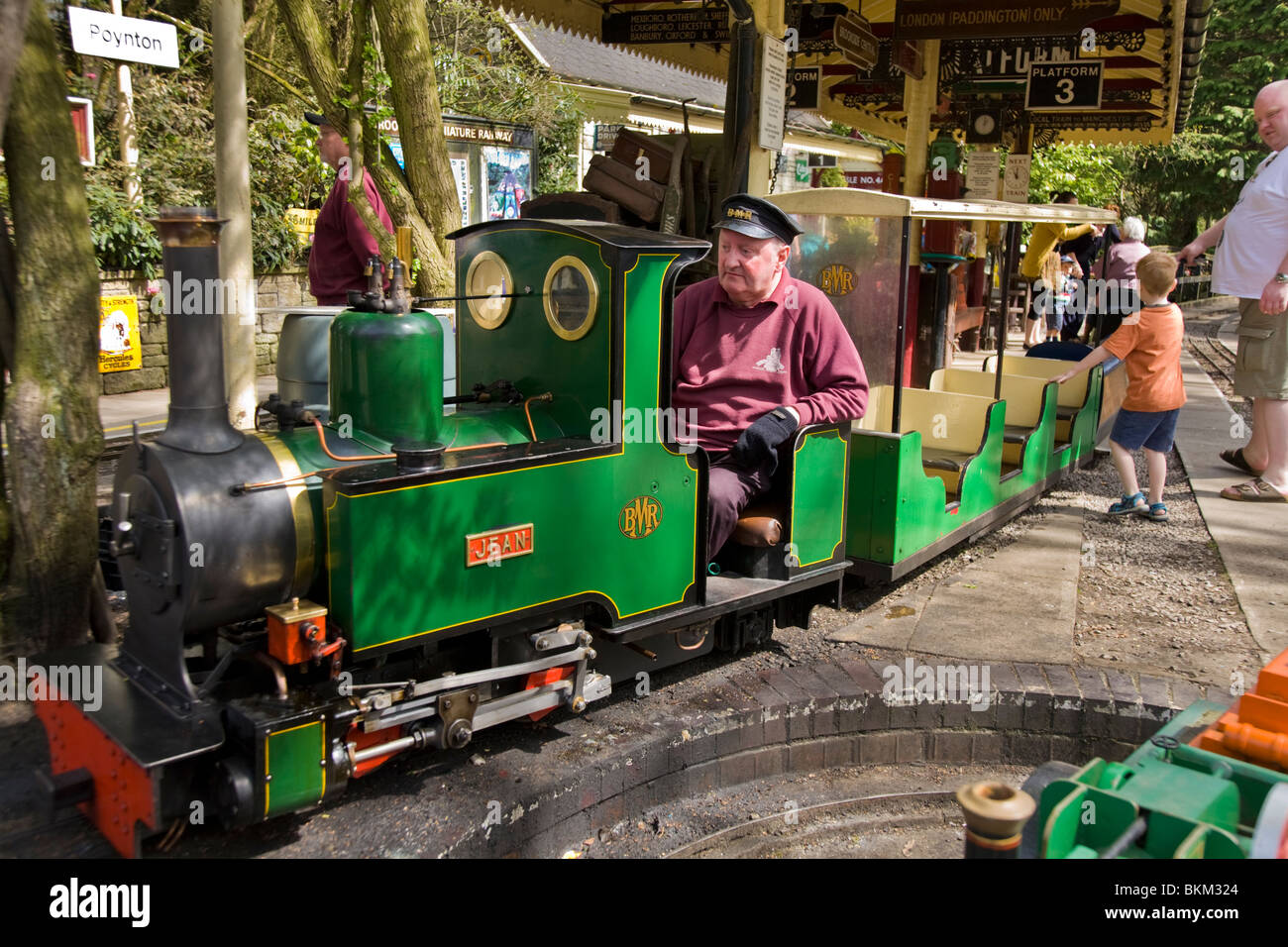 Miniature / model narrow gauge locomotive railway steam train and driver, at Brookside Garden Centre, Poynton. Cheshire. UK. Stock Photo
